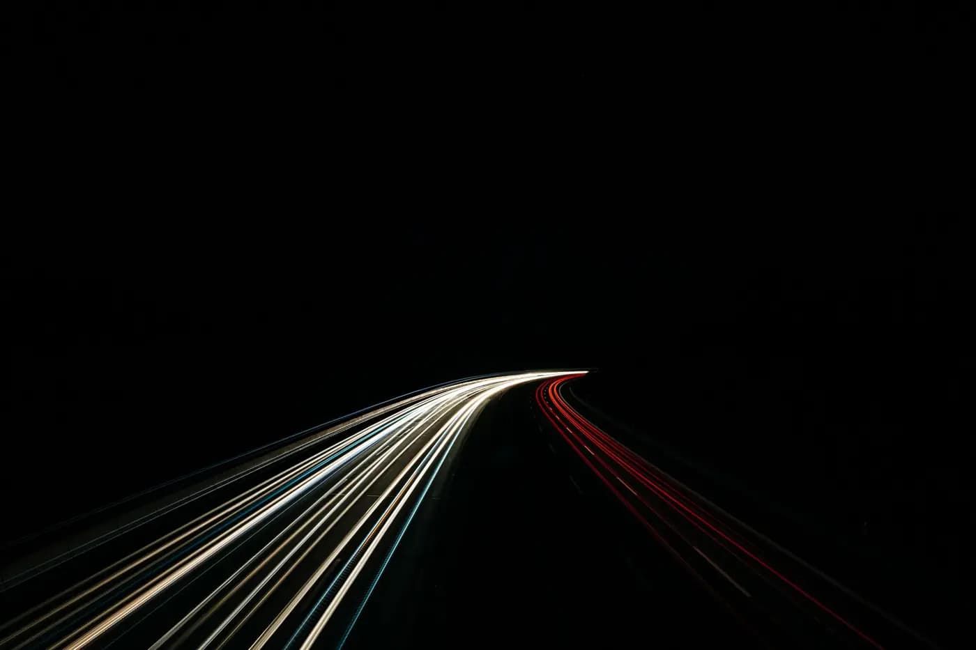 White and red light trails on a motorway at night