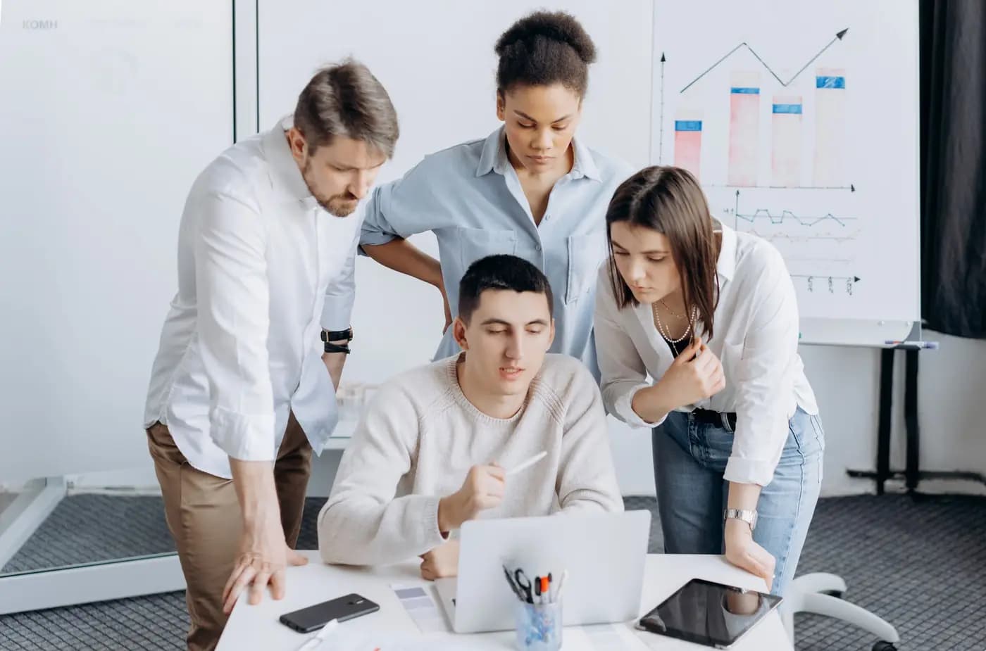 Team discussing results together on a laptop
